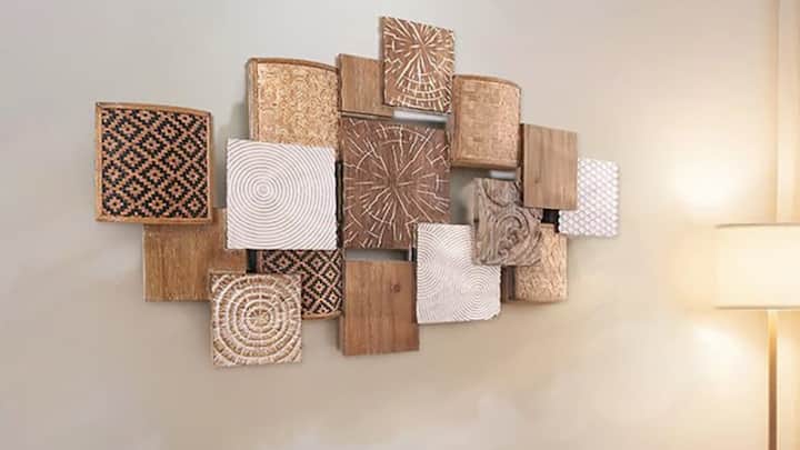 5. Try Wooden Wall Art: Hanging wooden wall art or wood framed wall panels in your living space can provide a fair amount of interest. You can select paintings with abstract, geometric, or polygon shapes and lines for a more contemporary look, or use raw wood with texturing for a more country feel to the interior. (Image Source: pinterest/ homary)