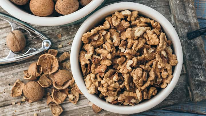3. Walnuts: Walnuts are known to improve brain health and memory retention. They're rich in omega 3 fatty acids and reduces stress. They keep you sharp and focused. A small handful of it is enough to fuel cognitive function. (Image Source: Canva)