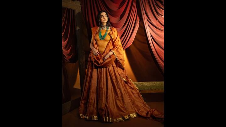 6. Sonam Kapoor: Sonam Kapoor made a bold statement with a body ornament that she wore as a blouse. This unique piece was crafted from red soil, Multani clay, and paper mache. The actress paired her blouse with rust toned lehenga and a matching dupatta. (Image Source: Instagram/@sonamkapoor)