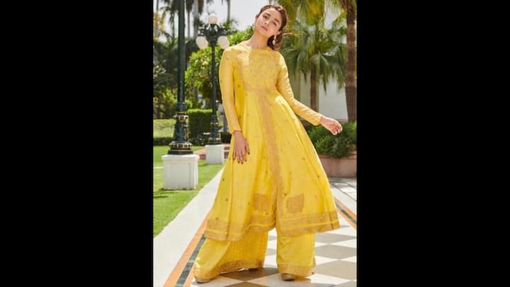 6. Radiant Yellow Anarkali Set: Alia Bhatt dazzled in a radiant yellow Anarkali suit set that she paired with elegant palazzo bottoms. The vibrant colour symbolises optimism and spiritual growth. She complemented her outfit with minimal jewellery that added a touch of charm. (Image Source: Pinterest/premcrush)