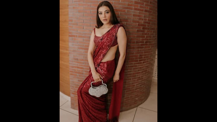 3. Kajal Aggarwal: Kajal Aggarwal dazzled in a monochromatic red saree with delicate sequin detailing. She paired her saree with a bralette style blouse that enhanced the outfit's glam. To add a contast, the actress accessorised with a chic silver handbag that elevated the entire look. (Image Source: Twitter/@My_VantagePoint)