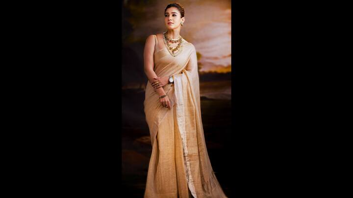 5. Nayanthara: Nayanthara exuded confidence and elegance in a golden tissue saree. She paired her saree with traditional gold jewellery that included a statement long necklace that radiated luxury. Adding a modern touch, the actress accessorised her look with a sleek watch that complemented the saree. The actress wore a matching sleeveless blouse that balanced traditional and contemporary styles. (Image Source: Twitter/@BoopalanVJ)