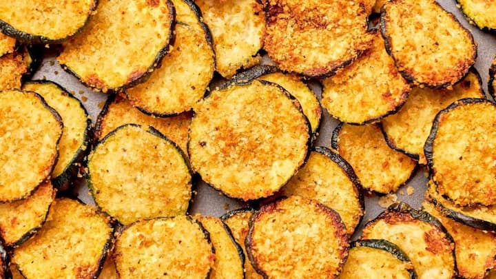 6. Zucchini Chips: Zucchini Chips are crispy snacks that are made by baking thin, seasoned slices of zucchini. This snack can be seasoned with spices according to preference that makes them versatile. These are low in calories and high in nutrients. (Image Source: Pinterest/simplyrecipes)