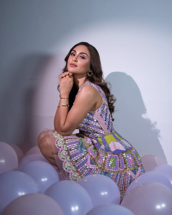 Krystle's makeup was flawlessly done, featuring a glossy finish that complemented her radiant skin. The glossy lips added a subtle yet chic vibe, while her eyes were enhanced with soft, subtle eye makeup, giving her a fresh and dewy appearance perfect for the celebration.