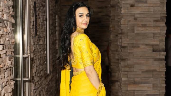 Add vibrancy to your traditional look with this yellow silk lehenga. The shade with traditional embroidery brings warmth, sophistication, and a ray of sunshine into any wedding celebration. (Image Source: Instagram/ realpz)