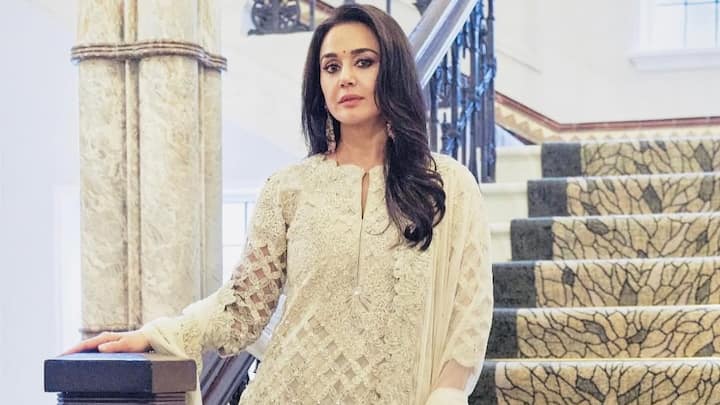 Embrace a dreamy, feminine look with this off-white net with embroidery. Following from Preity's subtle style, this elegant suit paired with a dupatta makes one stand out effortlessly at any celebration. (Image Source: Instagram/ realpz)