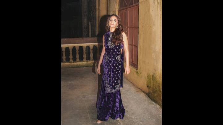 4. Purple Velvet Kurta Set: Keerthy Suresh wore a deep purple velvet suit with intricate embellishments. The sleeveless straight cut kurta had side slits that gave her a unique look. She paired her kurta with a flowing velvet sharara for a luxurious feel. (Image Source: Instagram/keerthysureshofficial)