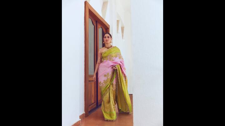 1. Elegant Traditional Look: Tamannaah Bhatia' pastel pink and green saree was adorned with intricate golden embroidery. The saree had golden embellishments all over the border which enhanced the look. She paired her look with a heavily embellished matching blouse and traditional gold jewellery that made it an ideal outfit for special occasions. (Image Source: Instagram/@tamannaahspeaks)