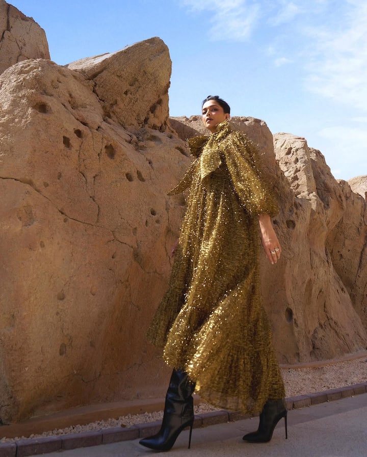 Deepika styled the dress with black leather boots and sky-high pencil heels for added drama.