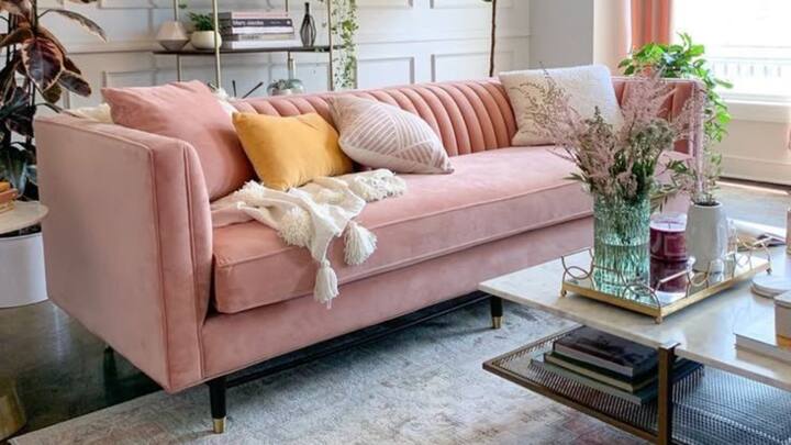 1. Furniture Pieces In Feminine Tones: Incorporate soft furniture pieces in colours like light pink, lavender, and emerald green as they portray grace and empowerment. Splashing out on an accent piece helps to not only beautify the space but also provides a cosy area for thinking and resting. (Image Source: Pinterest/Sarafragosoo)
