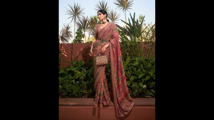 6. Multicoloured Saree With Jewelled Belt: The actress wore a multicoloured saree with heavy embroidery. Khushi Kapoor's saree with floral motifs had zardozi embroidery, sequins, and kundan detailing. The beautifully embroidered blouse had a beaded detailing at the sleeves and a scooped neckline that elevated the outfit's charm. She paired her outfit with a green jewelled belt and matching accessories. (Image Source: Instagram/@khushikapoor)