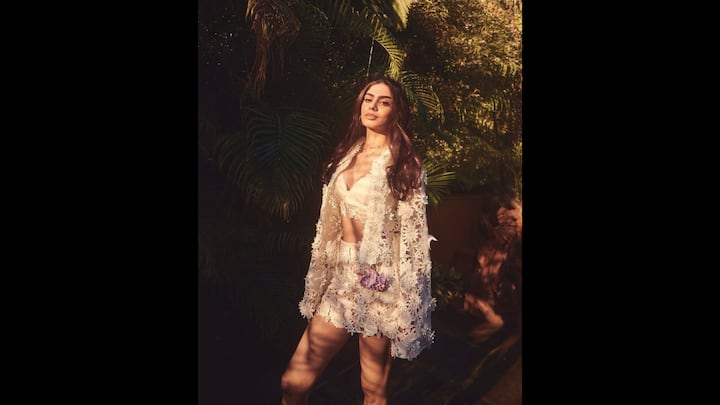 5. Dreamy Lace Outfit: Khushi Kapoor stunned in an elegant lace outfit. The lace co ord set featured a cropped bralette, sheer jacket, and a matching skirt. The floral embroidery all over the outfit gave a delicate and effortless look. The actress's outfit exuded bohemian charm. (Image Source: Instagram/@khushikapoor)