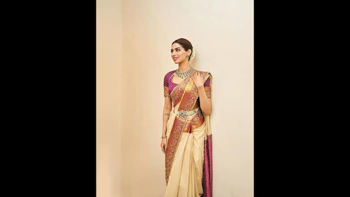2. Traditional Saree Look: Khushi Kapoor wore a traditional silk saree that gives her a regal look. The actress has paired a purple blouse with her saree to add a touch of contrast. She wore a traditional belt and jewellery that elevated her look. (Image Source: Instagram/@khushikapoor)