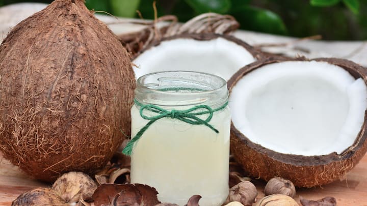 Coconut Oil: Coconut oil is one of the finest natural oils, and also a great color dissolver. By deeply soaking skin with moisture, it also helps patients with wounds to heal faster. Applying warm coconut oil on the skin for 10-15 minutes before gently wiping with a cotton pad makes for an effective cleansing routine after scrubbing with warm water and a gentle soap.   (Image Source: Canva)