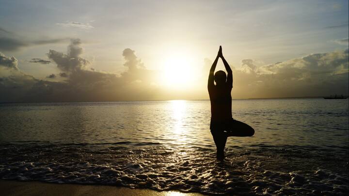 8. Tree Pose (Vrikshasana): Tree Pose helps in improving posture, balancing hormones, and strengthening legs. This pose reduces stress and helps focus the mind. It enhances balance, promotes inner stability, and supports the physical as well as mental well being in women. (Image Source: Canva)