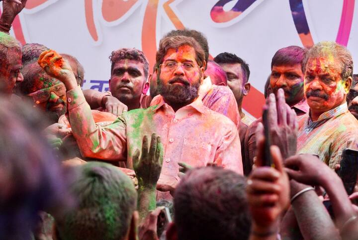 Maharashtra Deputy Chief Minister Eknath Shinde participated in Holi festivities outside the Tembhi Naka Shiv Sena shakha in Thane. (Photo: PTI)