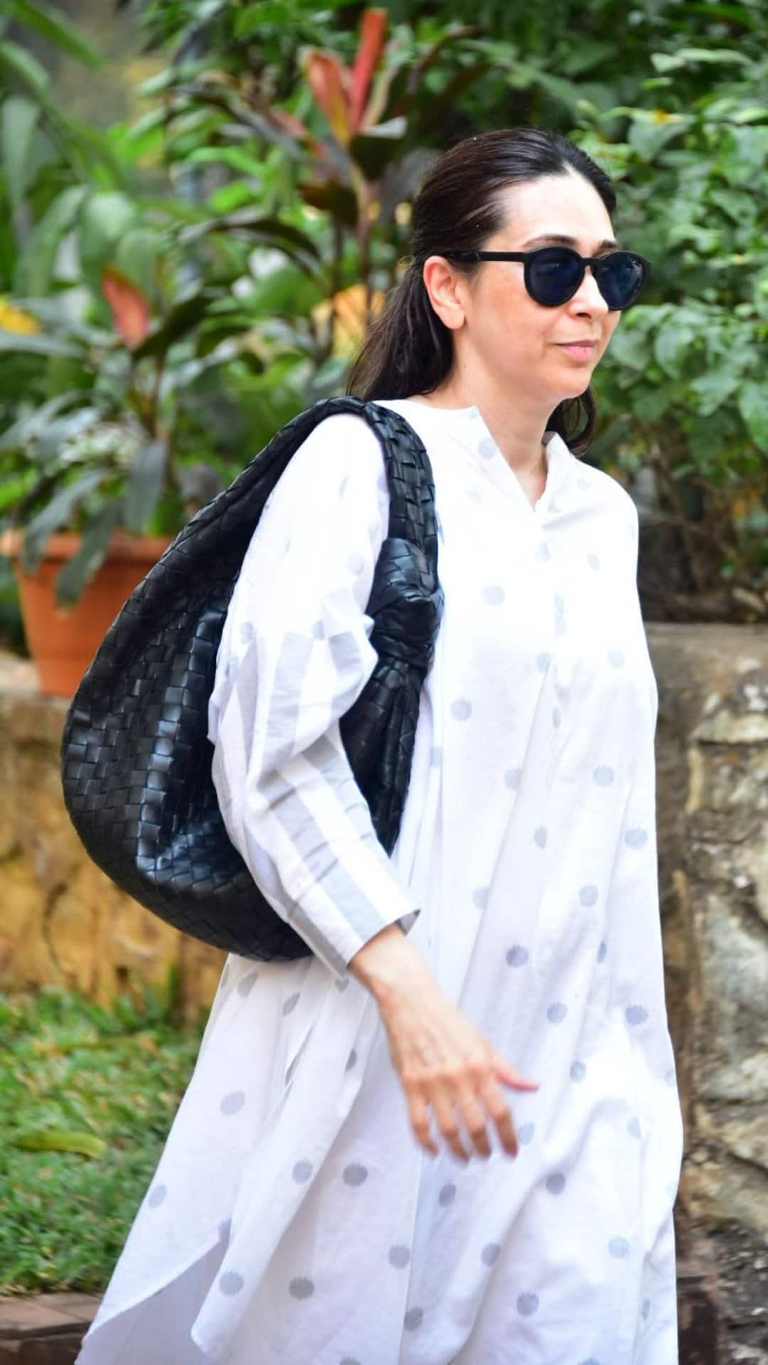 Karisma Kapoor Stuns in a Breezy White Suit, Serving Effortless Elegance Karisma Kapoor Stuns in a Breezy White Suit, Serving Effortless Elegance