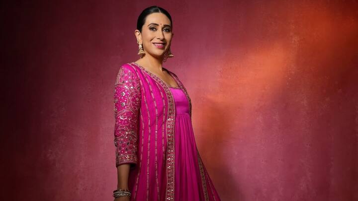Karishma embraces royalty in this pink full-length gown with gold embellishments. The flowing silhouette, detailed with delicate mirror work, exudes opulence, while the minimal styling allows the intricate craftsmanship to shine, making it an epitome of timeless elegance. (Image Source: Instagram/ therealkarismakapoor)