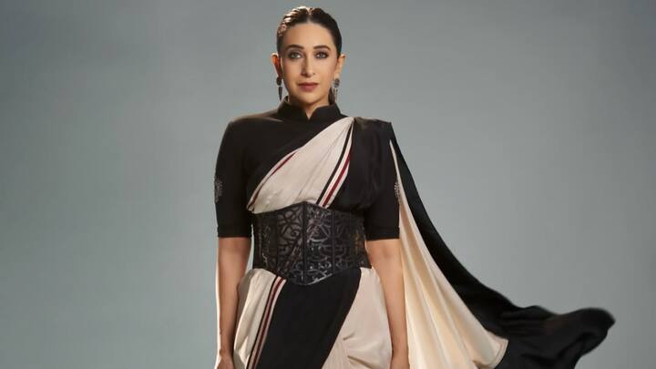 The black and white saree paired with a corset-style belt highlights a simple vibe of tradition along with a contemporary element. The black-and-white monochrome palette enhances its classical appeal, while the accentuated belt adds a contemporary flair, blending tradition with modern sophistication. (Image Source: Instagram/ therealkarismakapoor)