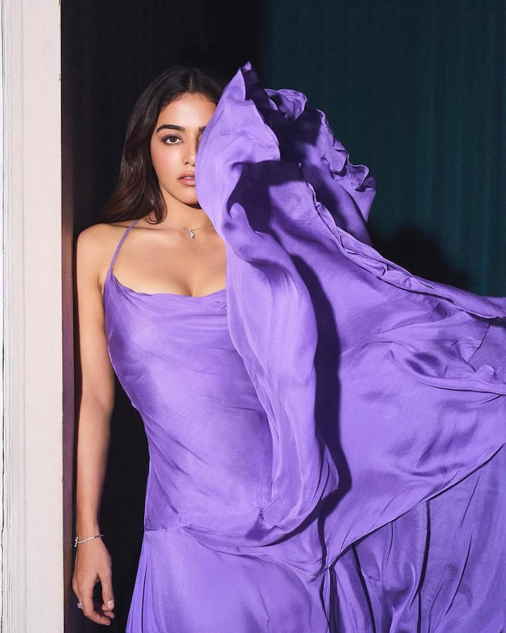 Wamiqa dons a breathtaking lavender-hued gown with an ethereal flow and delicate ruffled detailing. The asymmetry and soft draping of the dress create a dynamic visual effect, making it appear weightless as it moves.