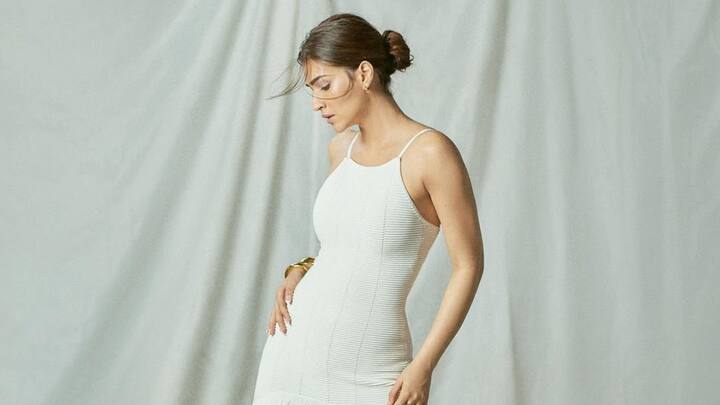 In a white midi bodycon dress with long fringes, Kriti redefined her summer elegance with the classic and contemporary styling. She matched her attire with gold-toned pieces of jewellery, and her fine, yet understated styling, made this outfit a vision of modern glam. (Image Source: Intagram/ kritisanon)