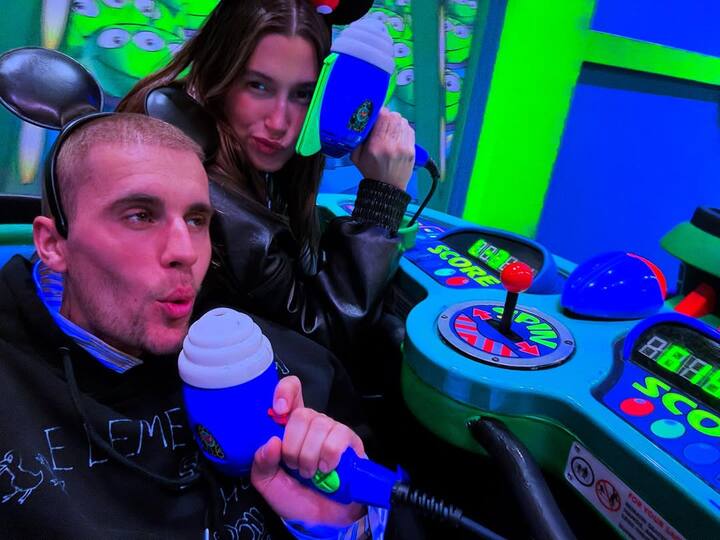 Another image captured Justin and Hailey having fun on the “Buzz Lightyear Astro Blasters” attraction, holding up their blasters.