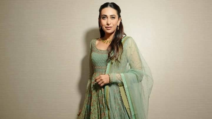 Karisma Kapoor in Mint Green: The pretty combination of a mint green printed anarkali is the best choice for any traditional look. Glamorous sleeves, precious gota work in gold, and minimal touch-up with sequins make the classic look fancy. (Image Source: Instagram/ therealkarismakapoor)