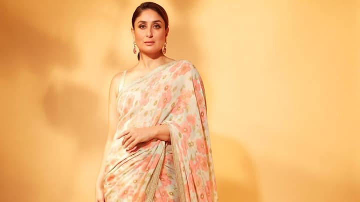 For an airy Eid look, Kareena's light ivory saree with delicate pink floral prints is an undeniably beautiful choice. The side-parted ponytail and minimal makeup all add to the charm of the dress with effortless elegance. (Image Source: Instagram/ kareenakapoorkhan)