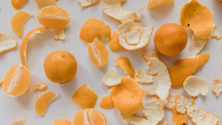 1. Rubbing Orange Peel: Orange peel can remove stains and whiten teeth naturally. The inner part of orange peel contains d-limonene which can support oral health. Gently rub the peel on your teeth daily for a few minutes for good results. (Image Source: Canva)