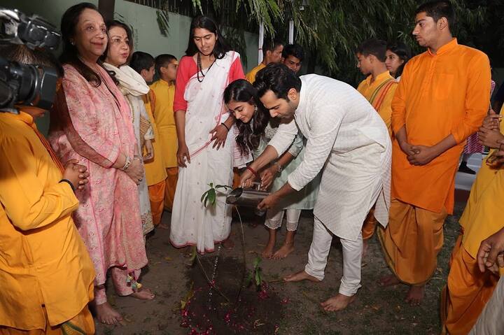 Another picture showed them bonding over a more laid-back activity, as they water a plant together
