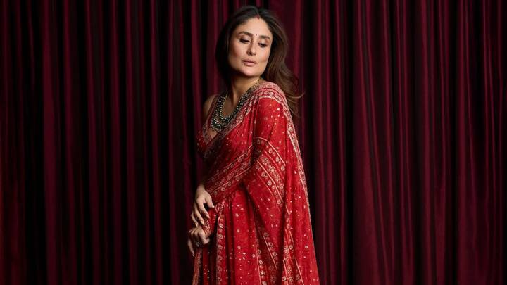 Kareena Kapoor's saree is intricately embroidered in red, giving off classic Indian heritage vibes, and the deep-neck sleeveless blouse gives it a contemporary twist. Her soft dewy makeup and kohled eyes give an elegant touch, just perfect for a grand celebration during Navratri. (Image Source: Instagram/ kareenakapoorkhan)