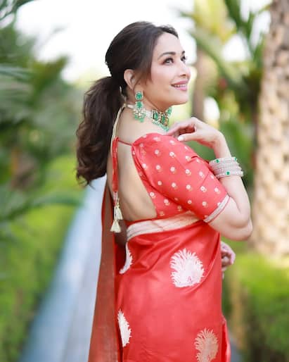 madhuri dixit orange dress Photos Madhuri Dixit snapped at Lower Parel (4) | Madhuri Dixit Images