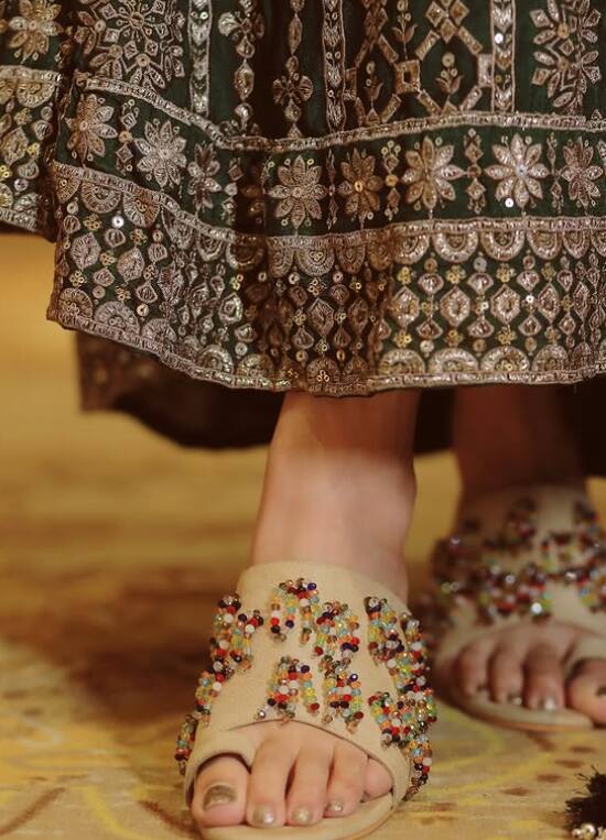 The actress has also shared a glimpse of her beautiful legs wearing beads footwear with a green suit.
