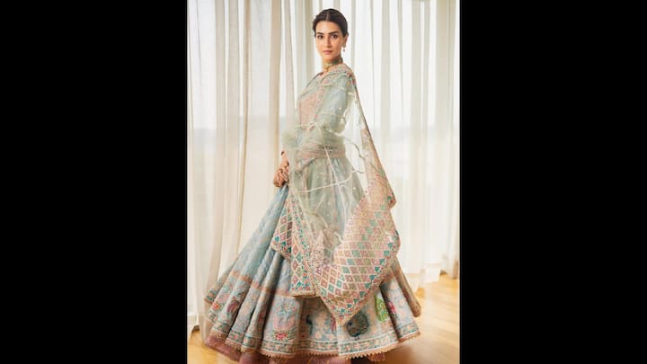 3. Pastel Elegance: Kriti Sanon's dreamy pastel blue lehenga featured intricate embroidery and a sheer dupatta with delicate embellishments. The outfit had rich textures and gave the ideal traditional look. The pastel Anarkali is the perfect blend of heritage and modern sophistication. (Image Source: Instagram/@kritisanon)