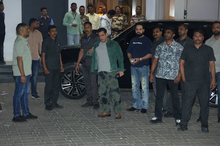 Salman is wearing a trouser in olive color print and is wearing a bean color shirt with a T-shirt.