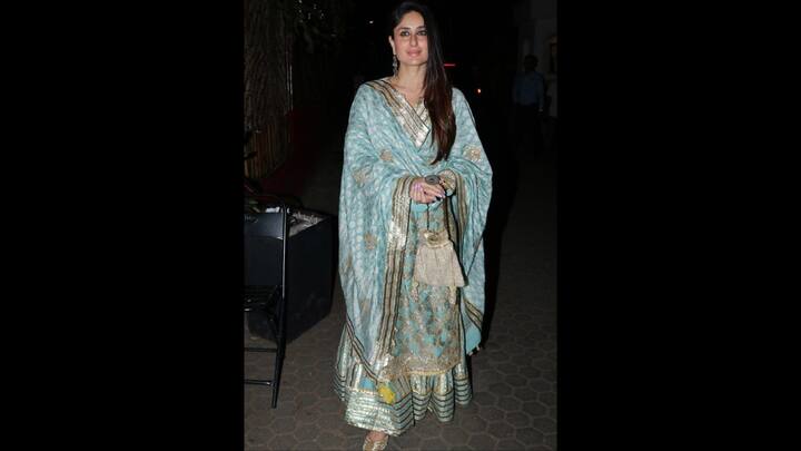 8. Blue And Gold Suit Look: The luxurious blue and gold sharara set worn by Kareena Kapoor made her look stunning. The outfit featured intricate embroidery and a rich dupatta. She paired her look with a matching potli bag that complemented her style. The actress's royal and graceful attire made it ideal for festivities and special occasions. (Image Source: Pinterest/vogueindia)