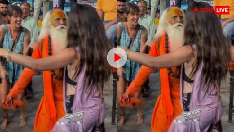 trending video viral a sadhu baba danced with a beautiful hot girl like an apsara on the road Trending: સંન્યાસી બાબાનો અપ્સરા જેવી સુંદરી સાથે ડાન્સ, બન્ને ભાન ભૂલીને રસ્તાં પર નાંચવા લાગ્યા, જુઓ વીડિયો