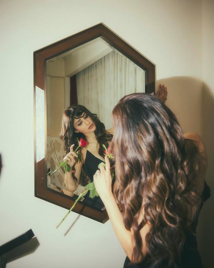 The flawless combination of bold makeup and soft styling creates a stunning contrast, elevating her beauty even further.