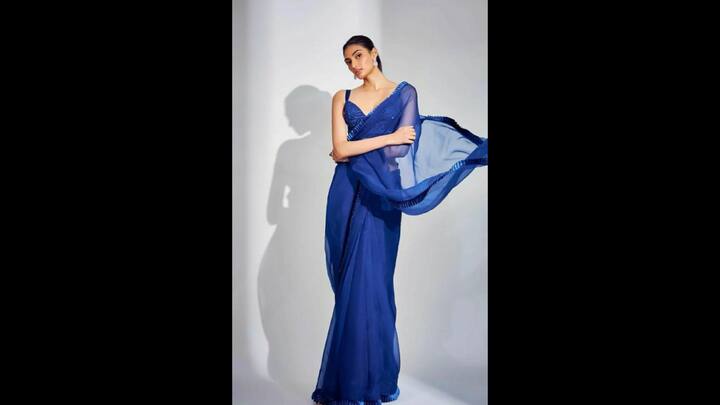 3. Athiya Shetty: Athiya Shetty wore a vibrant chiffon saree with a fitted blouse. The saree had lightly embellished borders that gave the actress an ethereal look. Athiya opted for an embellished blouse that beautifully complemented the sheer saree, making it ideal for Navratri celebrations. (Image Source: Pinterest/fashionwithshreya2)