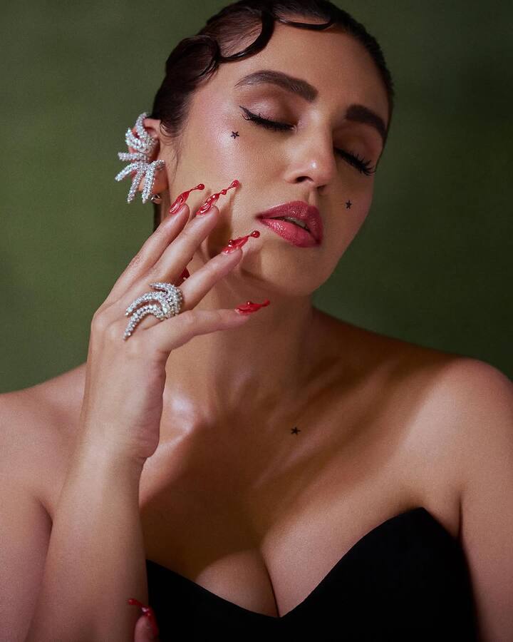 Her nails were a work of art themselves—long, blood-red, and tipped with drop-like embellishments, perfectly complementing the edgy theme of the outfit. ( All Pics Credit: Instagram/@iamhumaq)