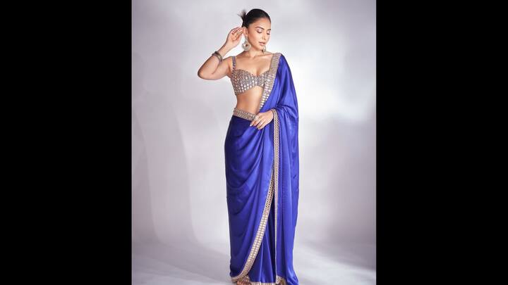 8. Rakul Preet: Rakul Preet's satin saree with an embellished mirror work blouse blended tradition along with glam. The minimal yet striking border and bold styling elevated the appeal for the traditional attire. The dazzling attire is ideal for Navratri festivities. (Image Source: Pinterest/mostlyfavs)