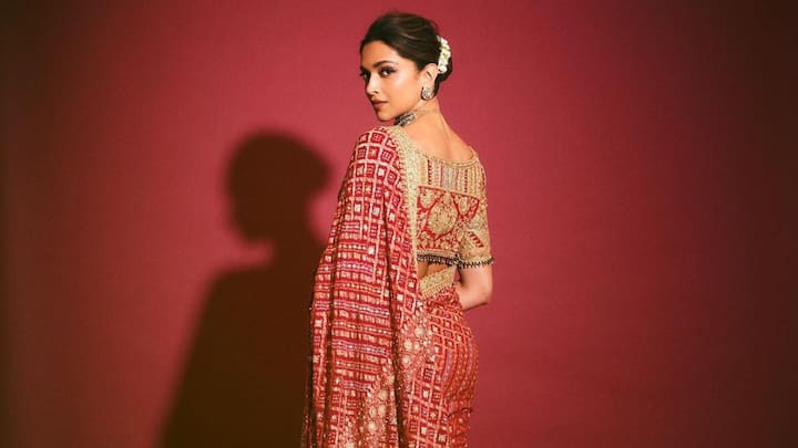 Deepika's richly embroidered red saree oozes tradition and elegance. Paired with minimal jewellery, winged liner, and a traditional bun with gajra, her attire is ideal for Ram Navami celebration in style. (Image Source: Instagram/ deepikapadukone)