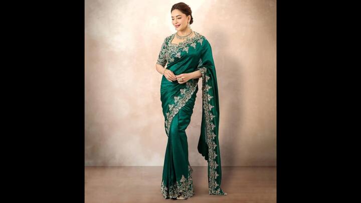 4. Madhuri Dixit: Madhuri Dixit's green saree exuded grace with its heavy embroidery along the border and blouse. The luxurious fabric drape complemented the actress. She completed her look with matching jewellery that gave her a charming look. (Image Source: Pinterest/Ri3N05)
