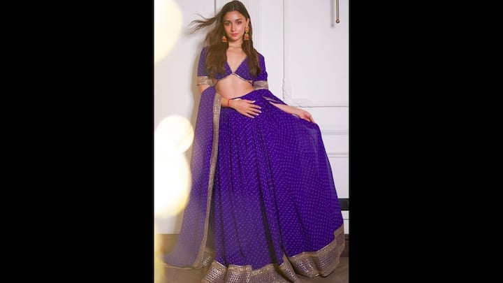 5. Alia Bhatt: Alia Bhatt wore a purple lehenga that had golden detailing all over it. Her deep V-neck blouse had a modern pattern which elevated the attire. Her traditional outfit had golden lace detailing that added grace and made her look ideal for Navratri celebrations. (Image Source: Pinterest/wedmegood)