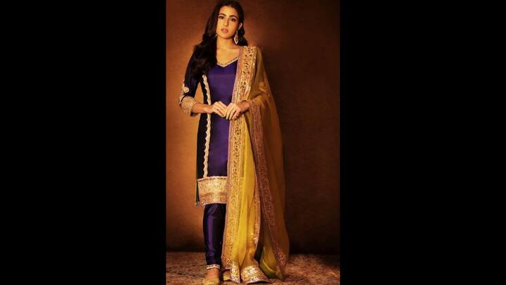 7. Sara Ali Khan: Sara Ali Khan wore a purple suit that she paired with a yellow dupatta to add a contrasting touch. The outfit had a rich fabric, making it ideal for special occasions. Her ethnic outfit had regal gold detailing and lace work on it. The actress paired her fit with matching juttis and accessories. (Image Source: Pinterest/vidushirathore396)