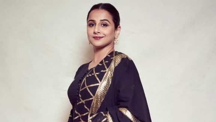 Vidya Balan's deep purple sharara suit with gold laces is perfect as an Indian traditional wardrobe for the auspicious Navratri seasons. She holds it all under simple accessories to allow the outfit to speak for itself, comfortable as well as festive. (Image Source: Instagram/ balanvidya)