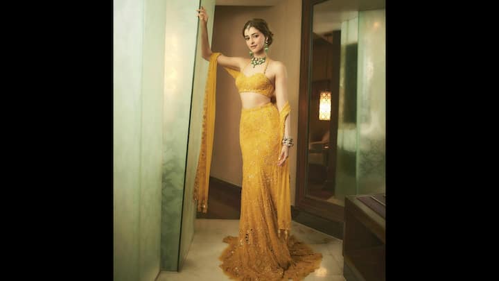 5. Vibrant Yellow Lehenga: Ananya Panday dazzled in a vibrant yellow lehenga that had intricate embroidery all over it. She wore a bralette style blouse and a delicate dupatta that exuded festive glam. She accessorised her look with emerald green jewellery that added a touch of contrast to her traditional attire. (Image Source: Instagram/@ananyapanday)