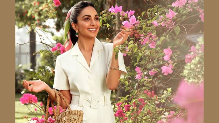 Her white jersey dress with light and breezy allure offers some severe ruching spag with straps. With its sheer hem and floral-inspired trim, it's perfect for a summer brunch or day event. (Image Source: Instagram/ kiaraaliaadvani)