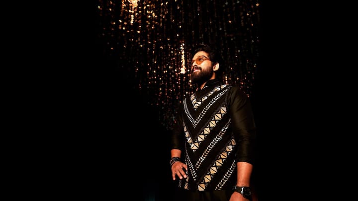2. Regal Glamour In Black: Allu Arjun exuded a royal charm in his black kurta that had intricate golden embroidery and geometric detailing. He added tinted shades, stacked bracelets, and a bold luxurious wrist watch with his look that gave him a modern flair. (Image Source: Instagram/@alluarjunonline)