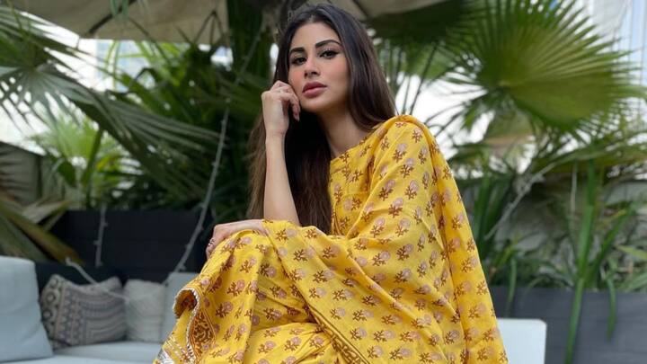 Mouni Roy: Mouni looks elegant in a yellow sharara set with floral prints and a hint of gota work. The sleeveless pattern and airy fit make it an endearing choice for daywear. (Image Source: Instagram/ mouniroy)